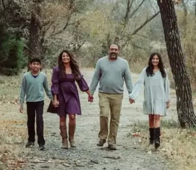 rajesh and anjana bhakta with their children walking on a path
