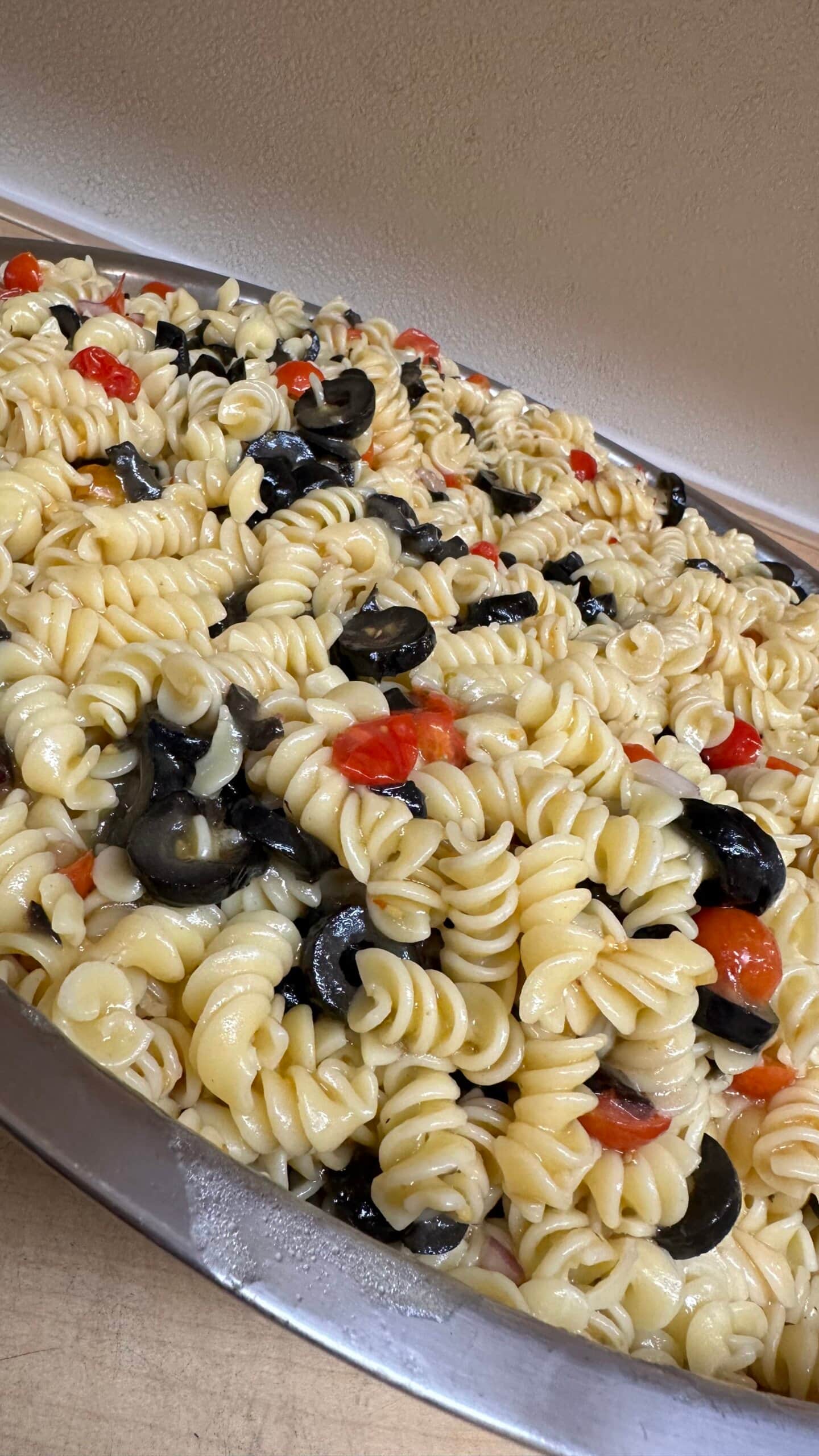The completed pasta salad with tomatoes from the garden