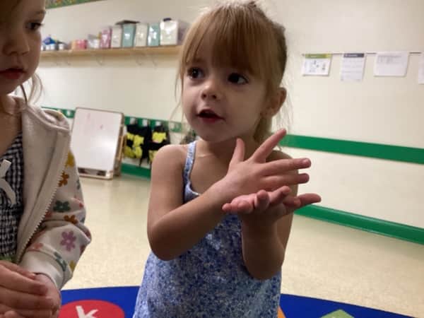 child learning Stop! in toddler room