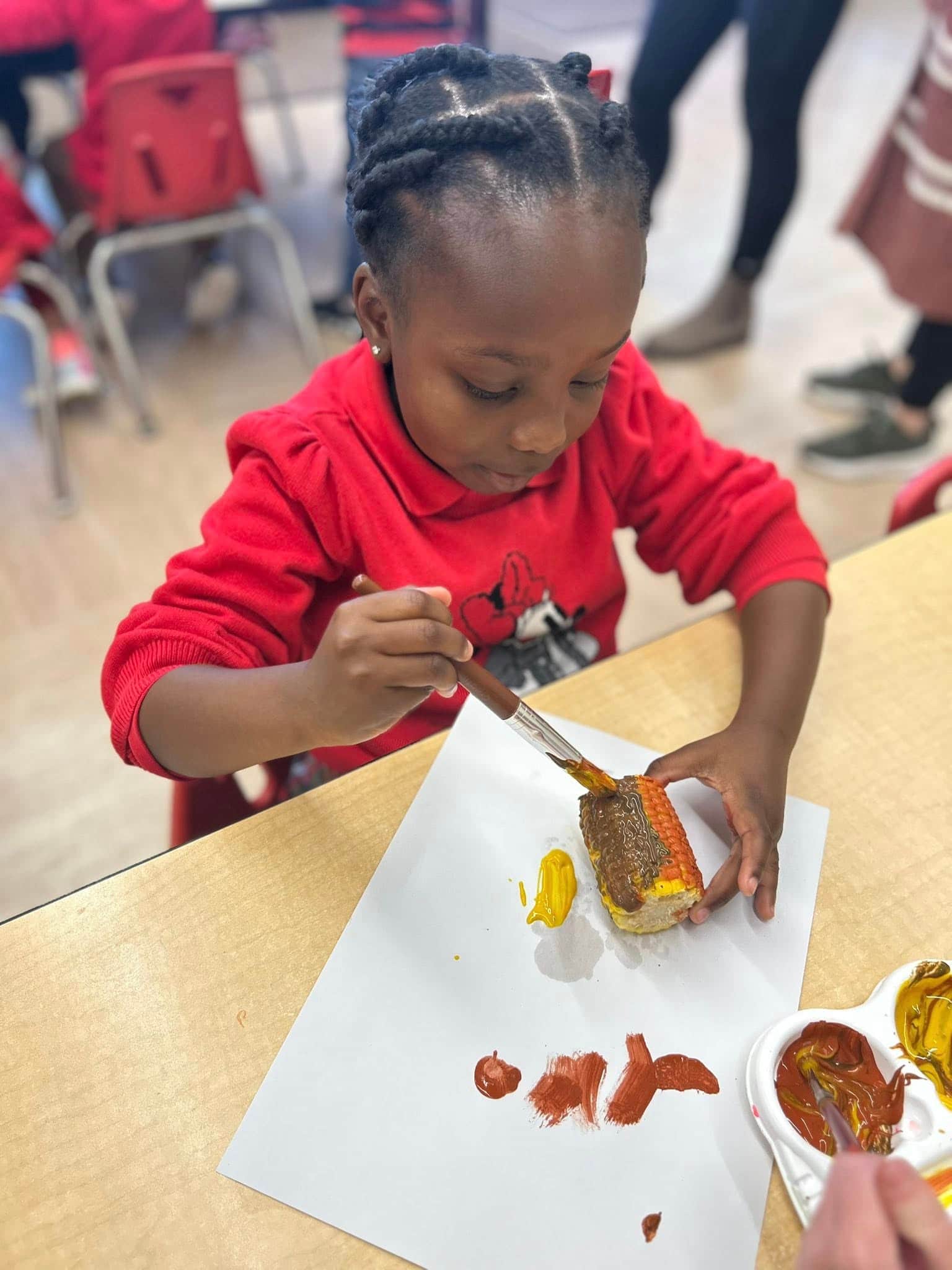 child painting corn