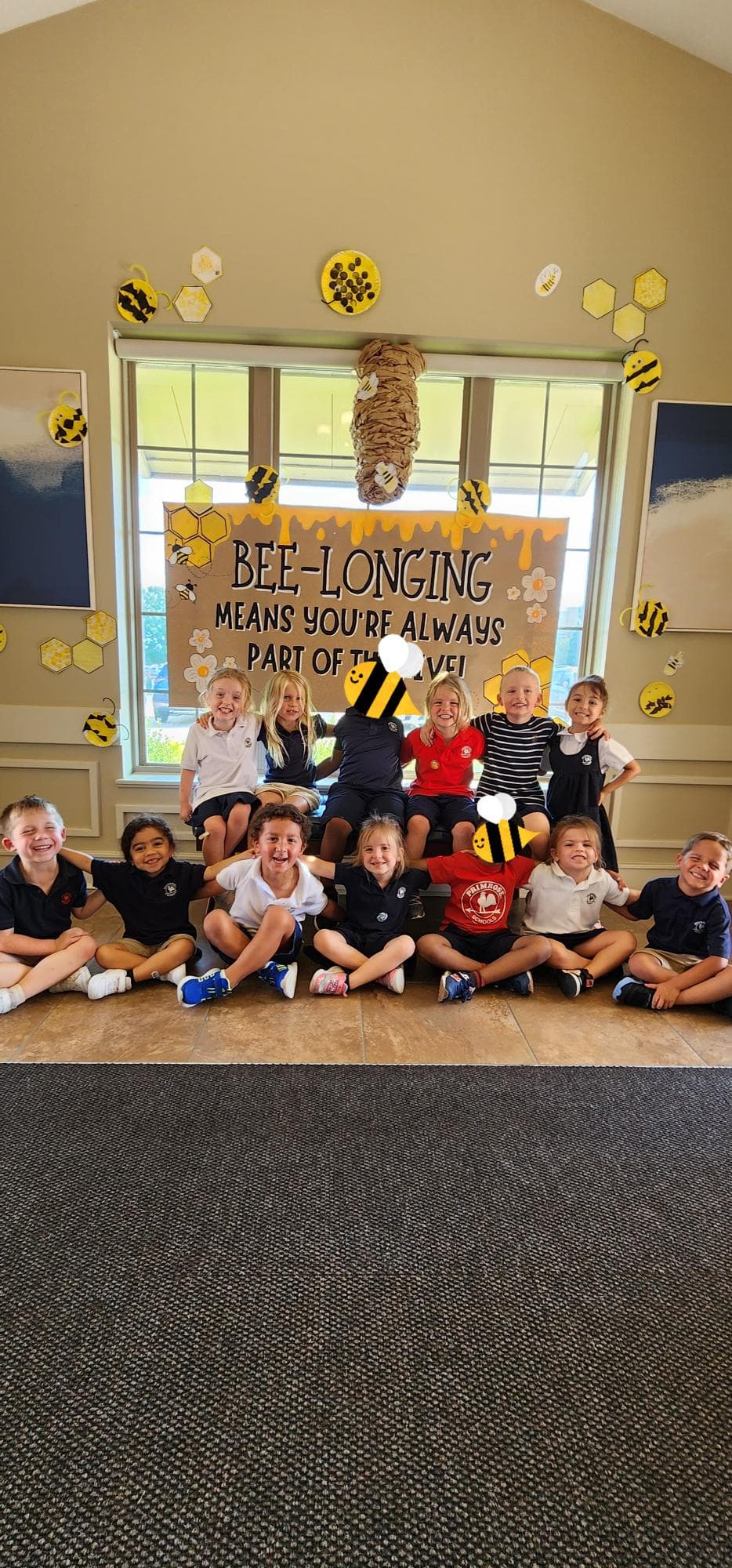 Pre-K students showing artwork from the Belongingness Project 