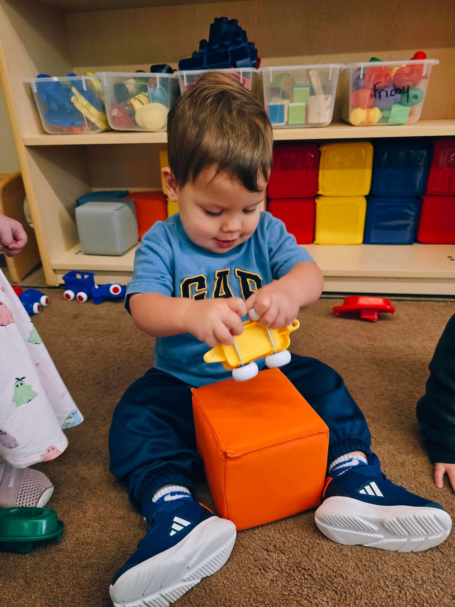 Toddler child playing with blocks during center time at Primrose School at Heritage in Fort Worth, Texas.
