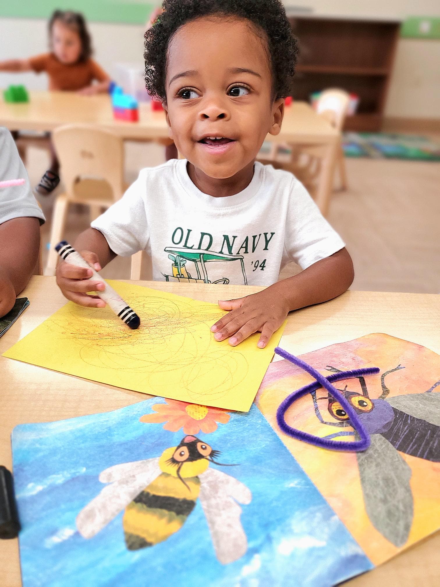 Student creating a bug during a small group nature activity