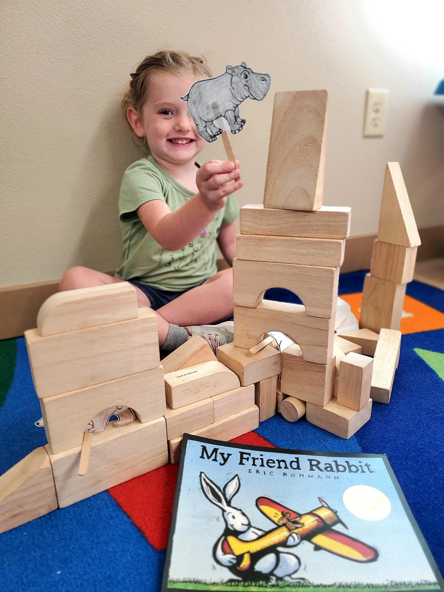 Student matching story characters during a small group literacy activity