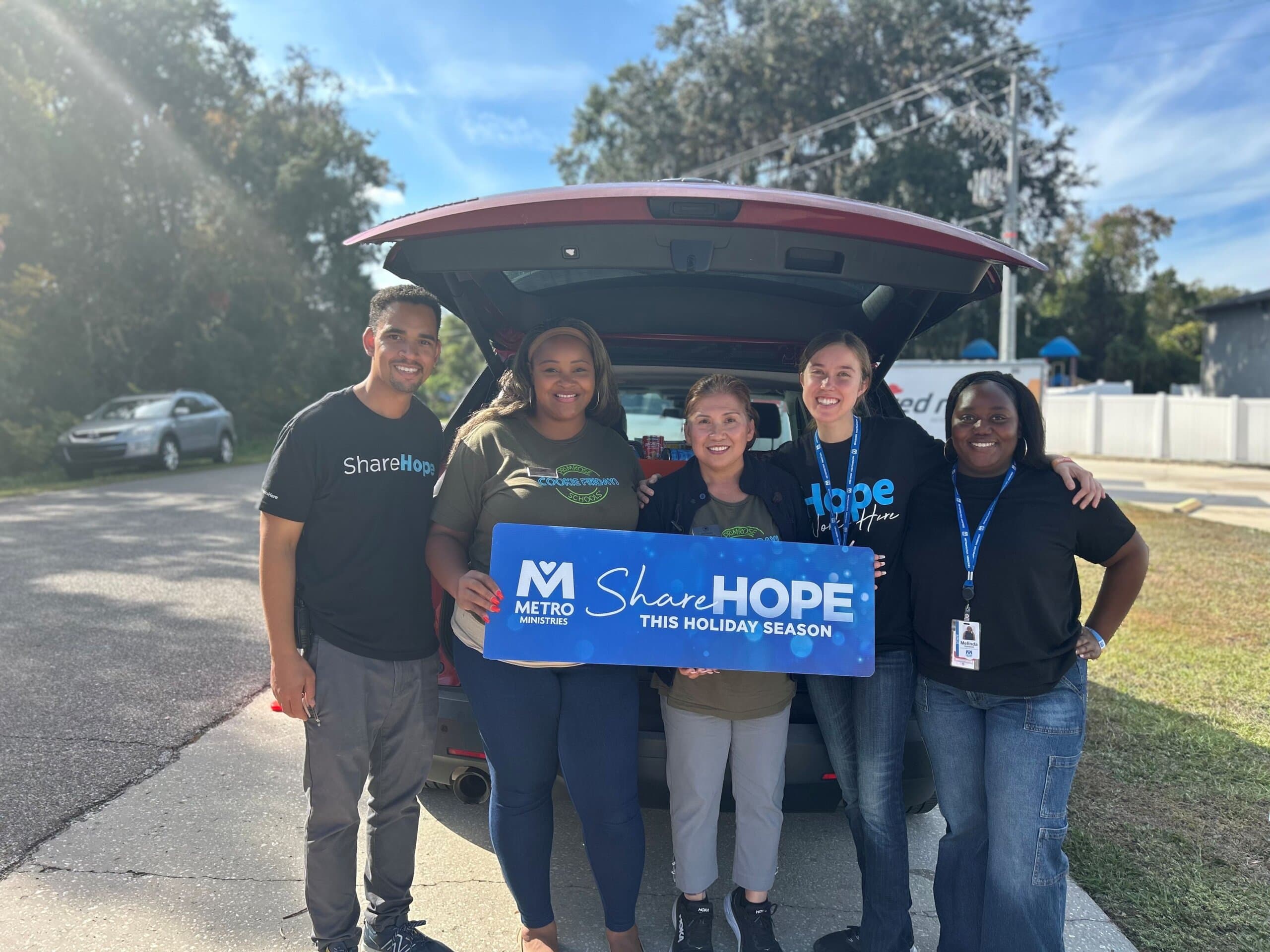 Primrose School at Collier Parkway students and families donating over 350 canned goods to Metropolitan Ministries, highlighting community involvement, preschool service projects, early childhood education, and teaching children generosity and compassion