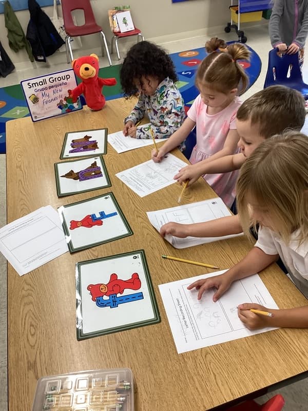 Pre-kindergarten kids practicing handwriting skills at Eagle Ranch preschool.