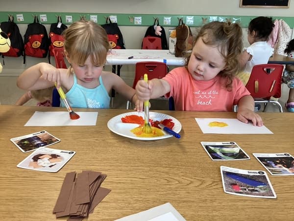 Preschool students painting during art activity at North Fort Worth preschool