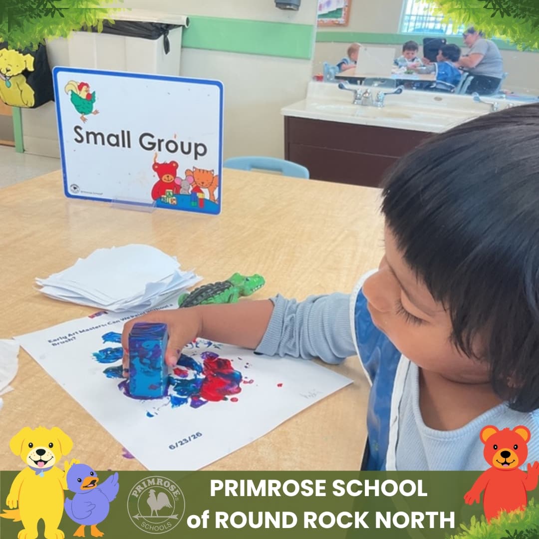 Child at Primrose School of Round Rock North creating artwork during a small group classroom learning activity.