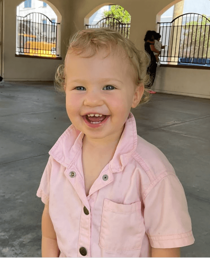 toddler boy smiling at school