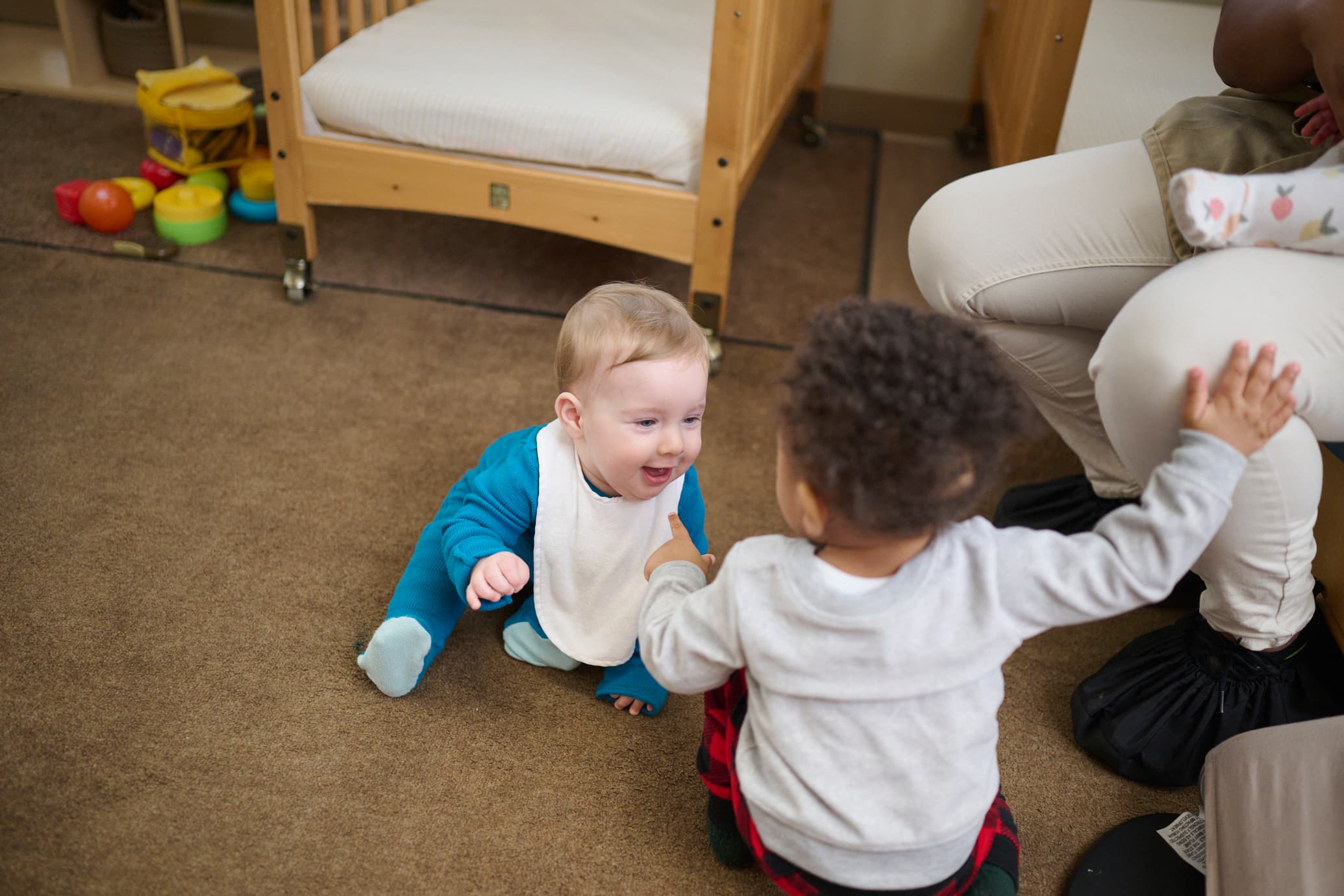 Two infants playing together