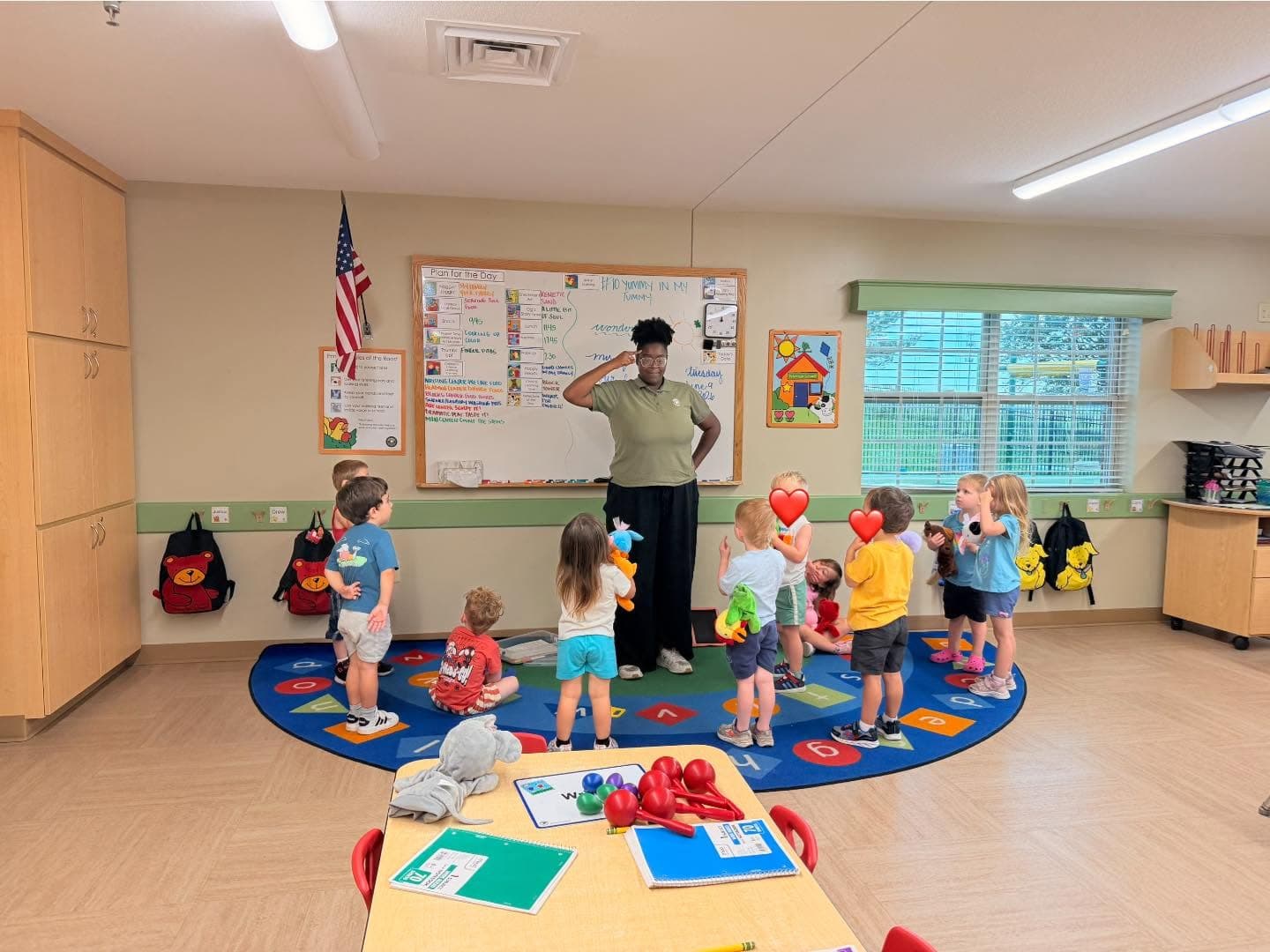 A teacher teaching students at circle time 