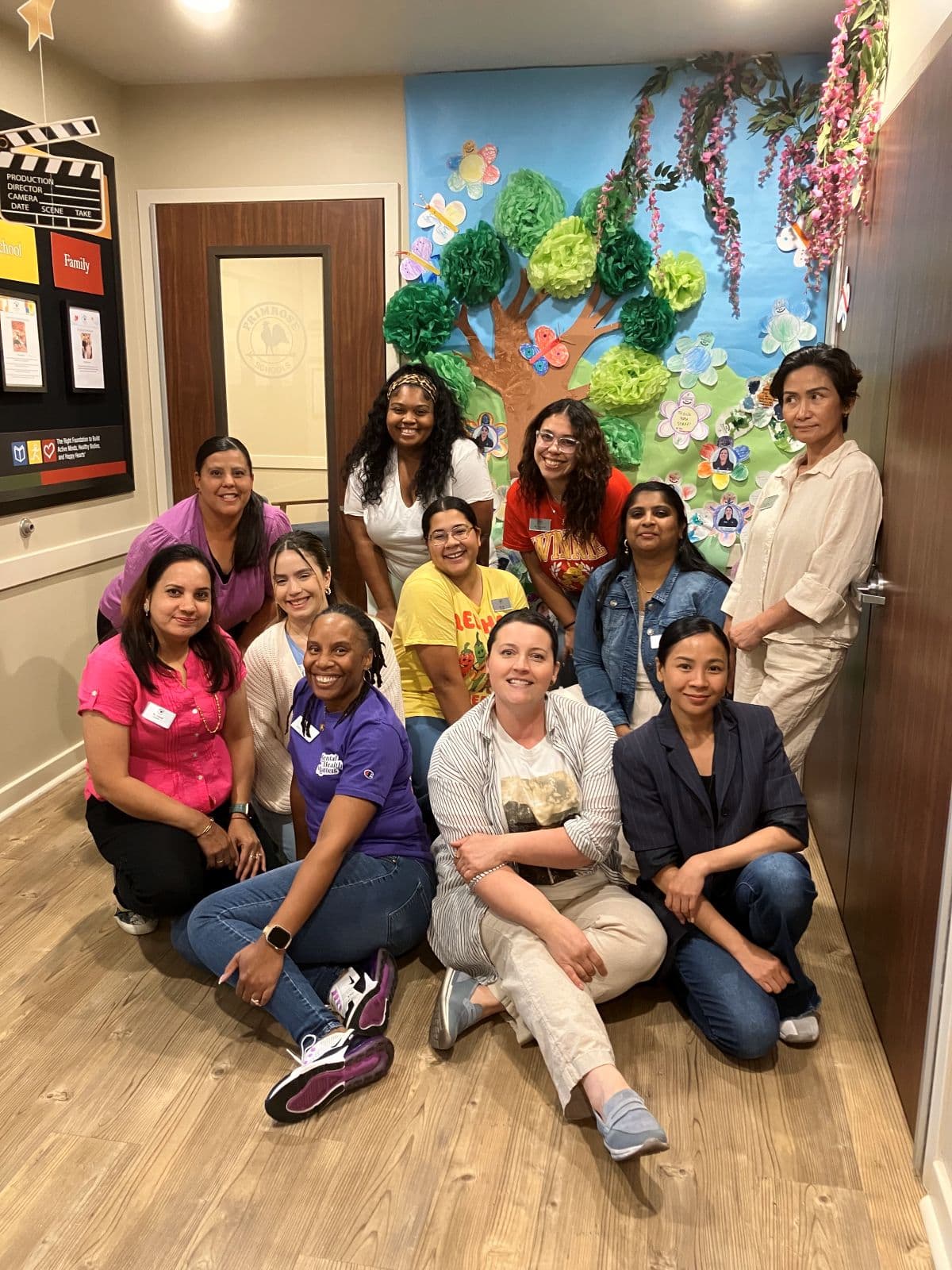 Picture with teachers and Gratitude Garden created by families and children 