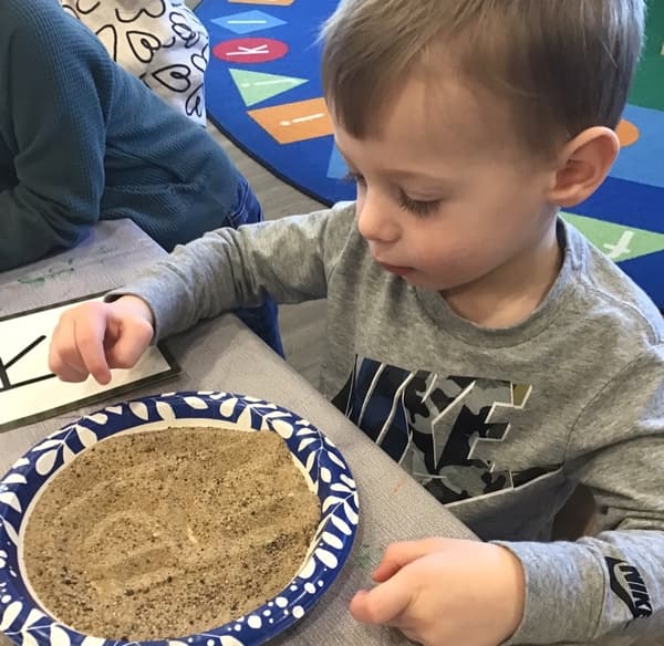 Practicing letters during Children's Choice learning centers