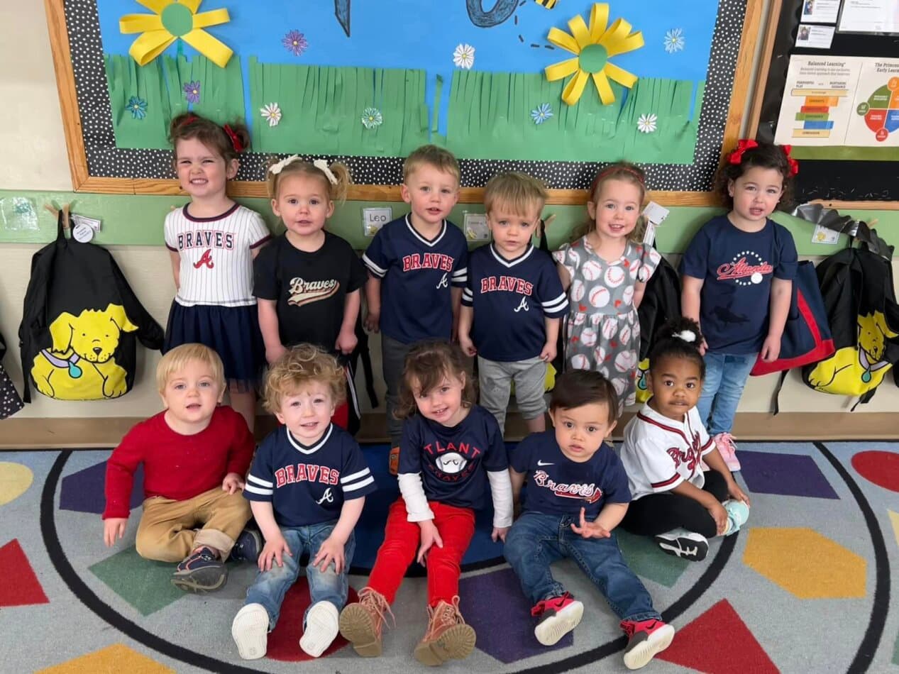 children dressed in atlanta braves merchandise