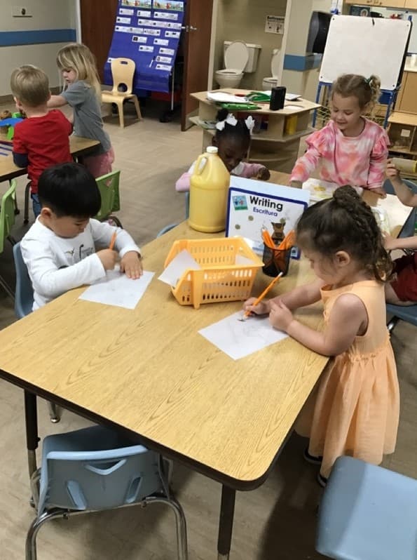children at the writing center