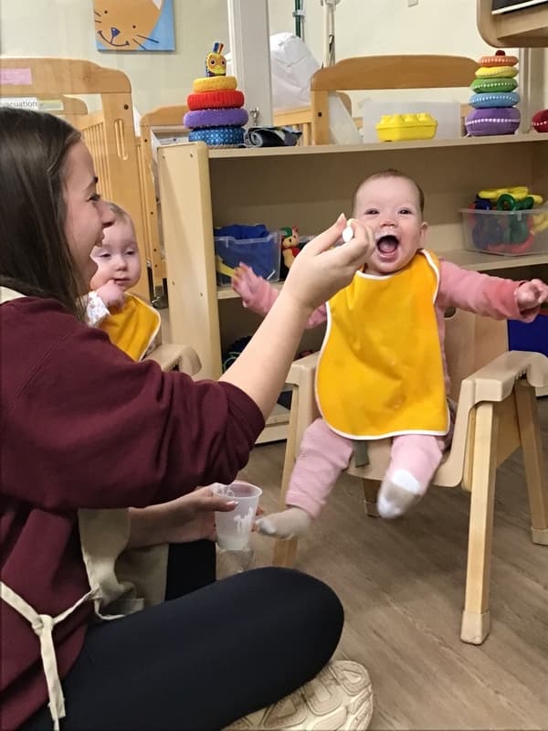 infants enjoying lunch