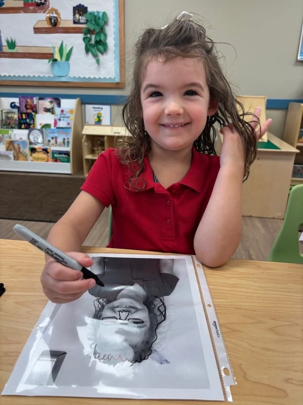child making a self portrait