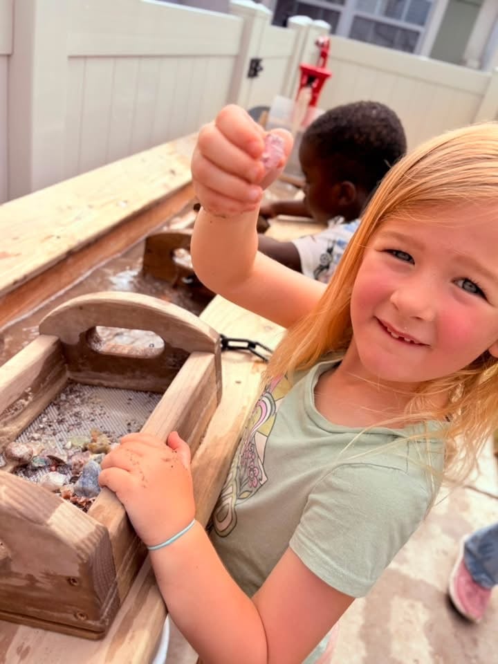 Kindergarten student gem mining during STEM project at Primrose School