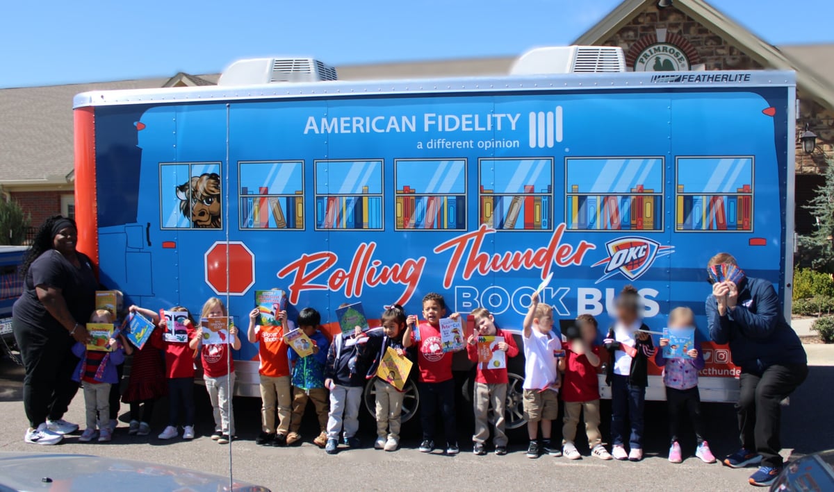 Children In front of thunder bus