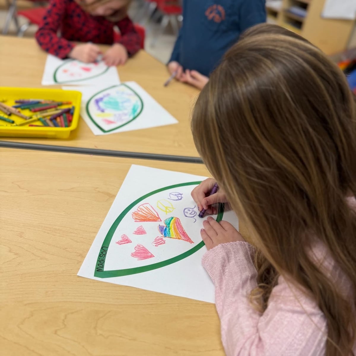 Primrose Burlington kindergarten students drawing kindness leaves for a classroom kindness tree during Martin Luther King Jr. Day celebration