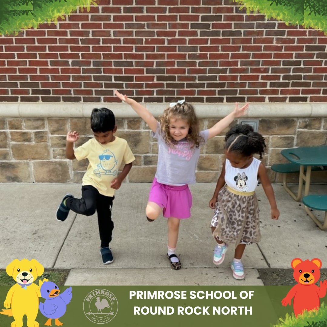 Children at Primrose School of Round Rock North practicing balance and gross motor skills during an outdoor activity.