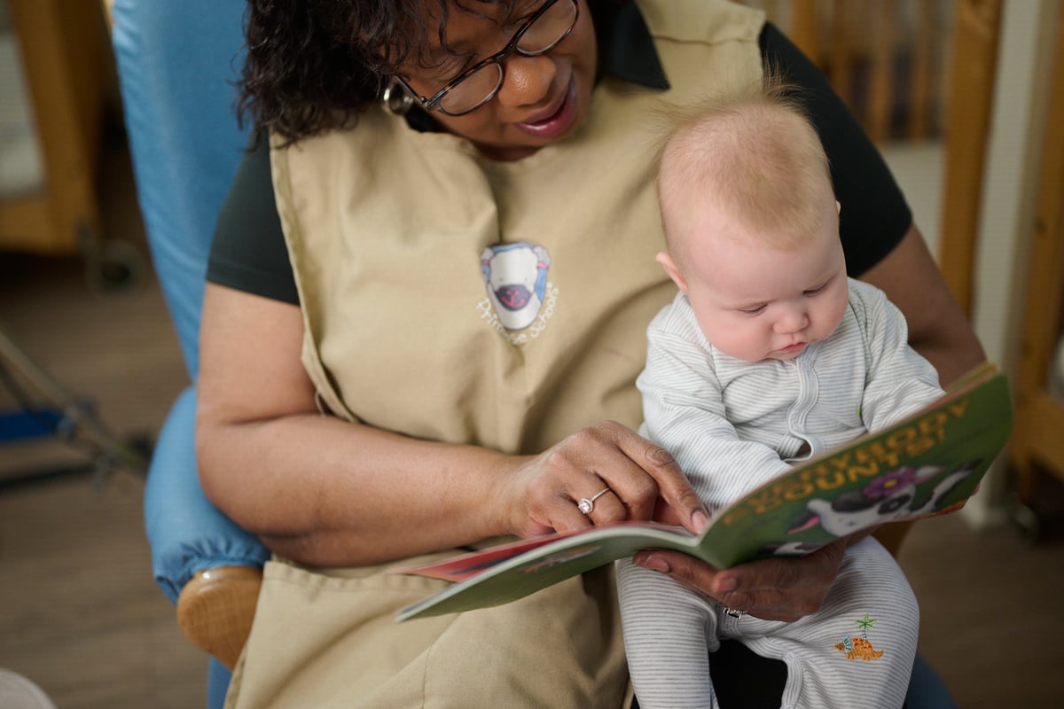 Teacher reading with infant