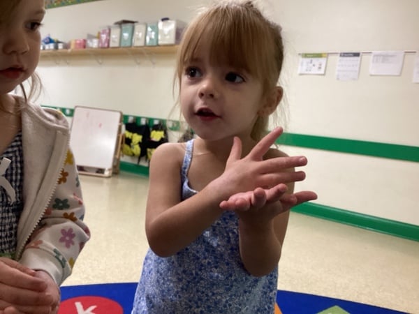 child learning Stop! in toddler room