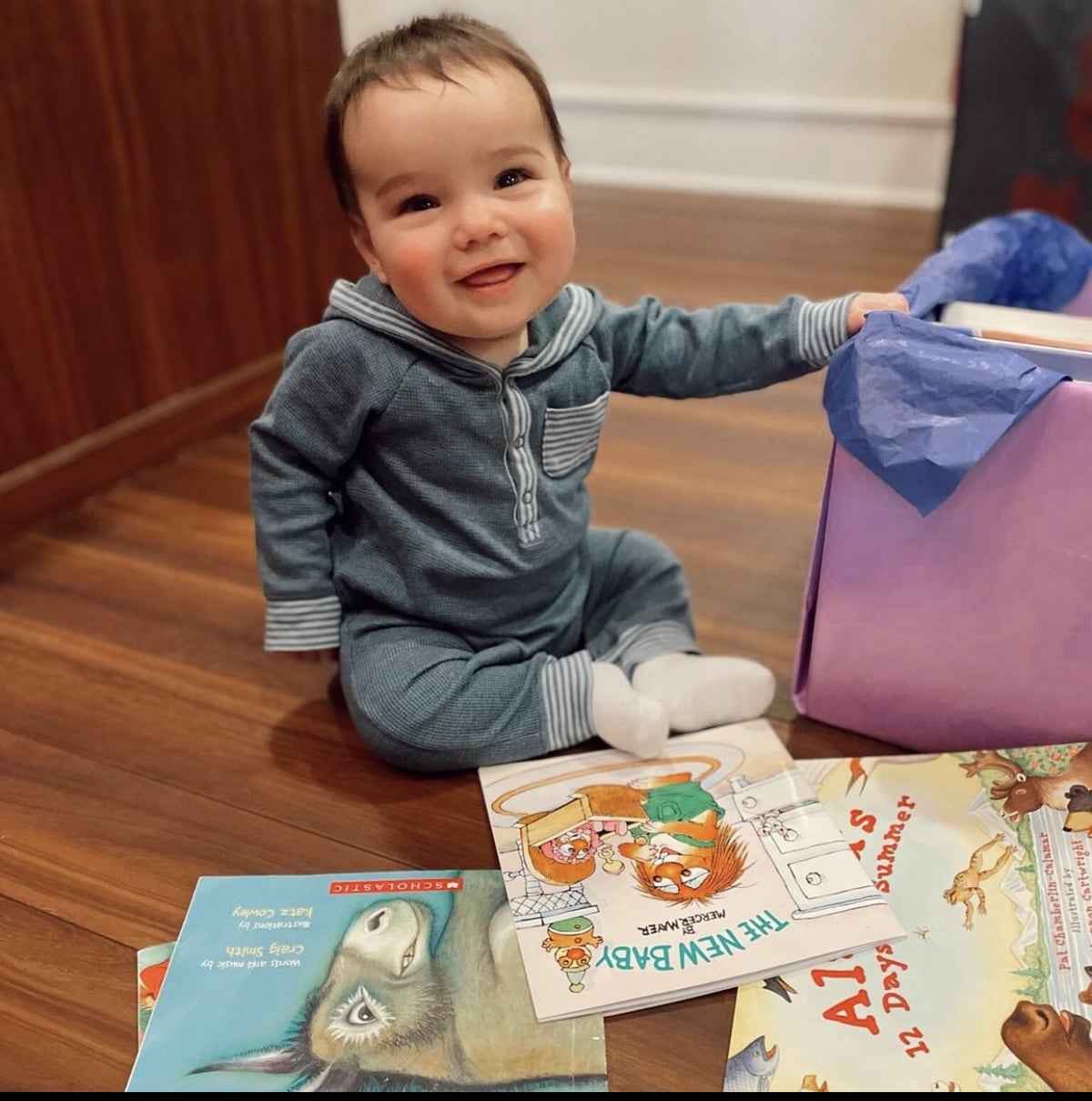 Infant student with books