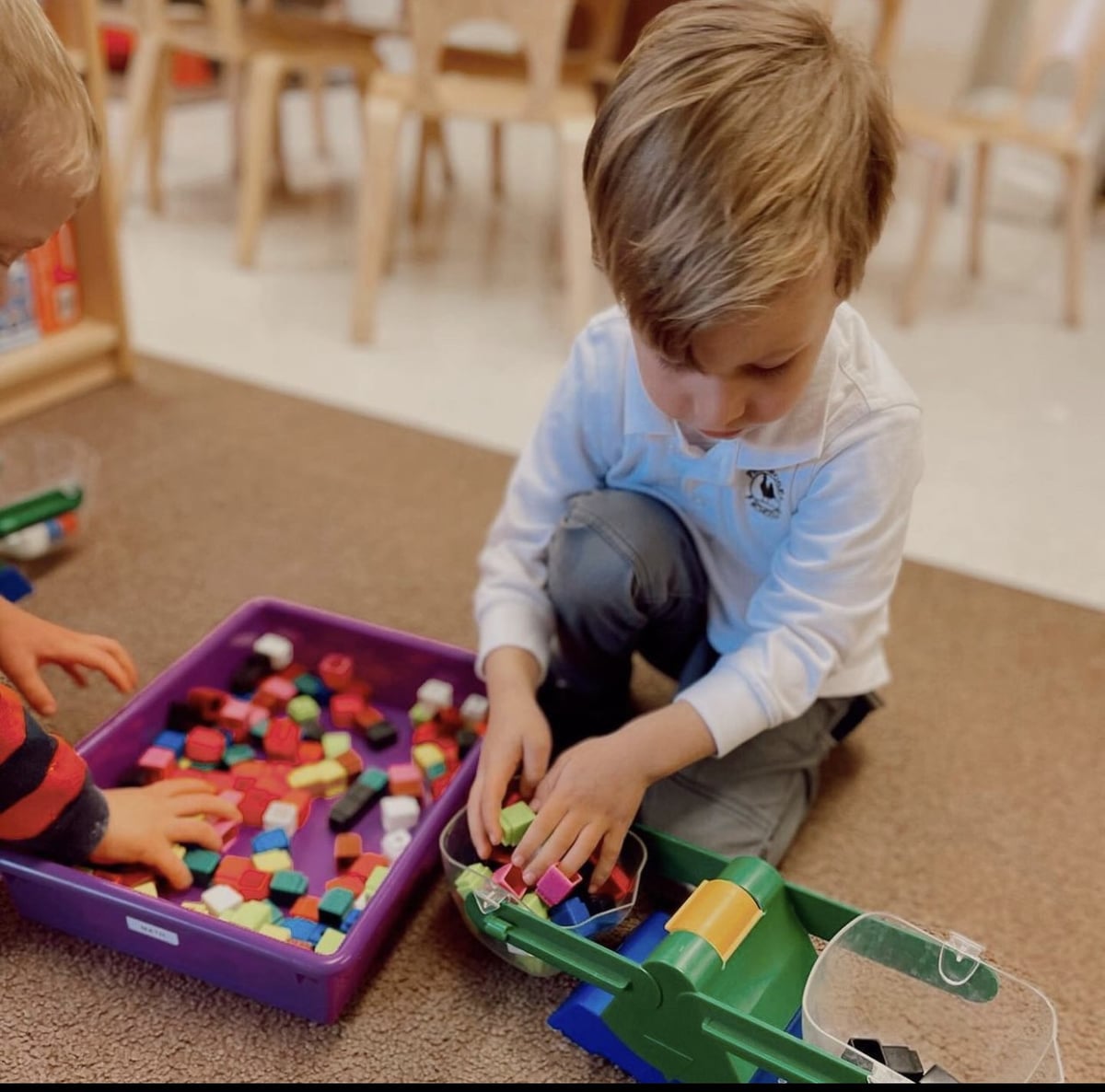 Student playing with blocks