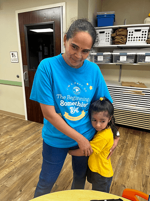 woman and child hold onto each other