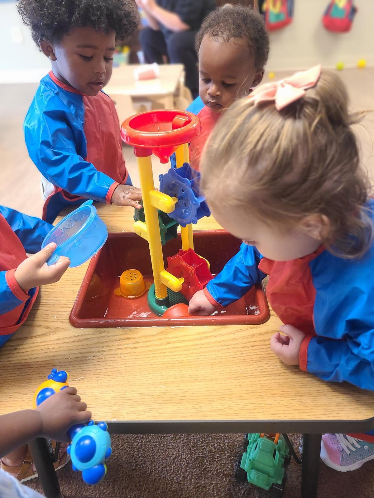 Toddlers in sensory table