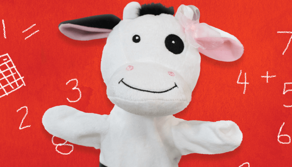 cow puppet shown with handwritten numbers