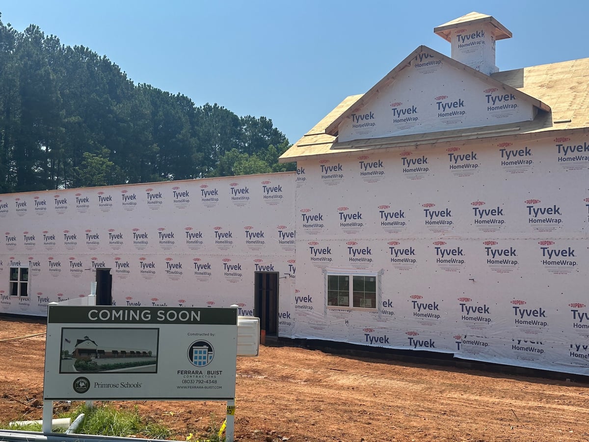 image shows primrose waxhaw building wrapped