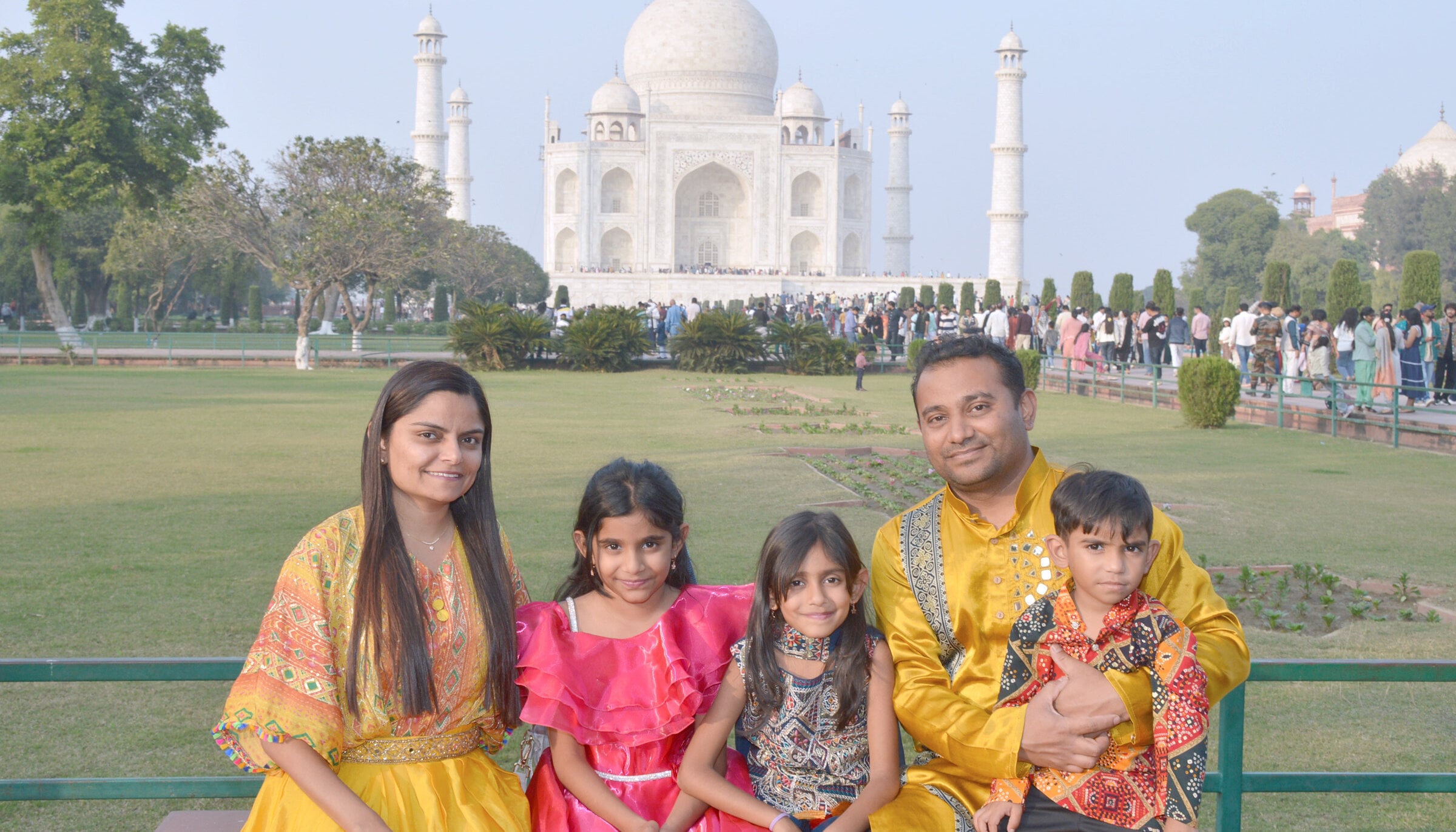 The patel family posing in front of the Taj Mahal
