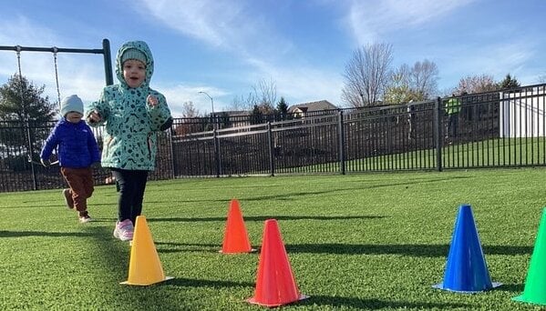 Child Kicking Ball