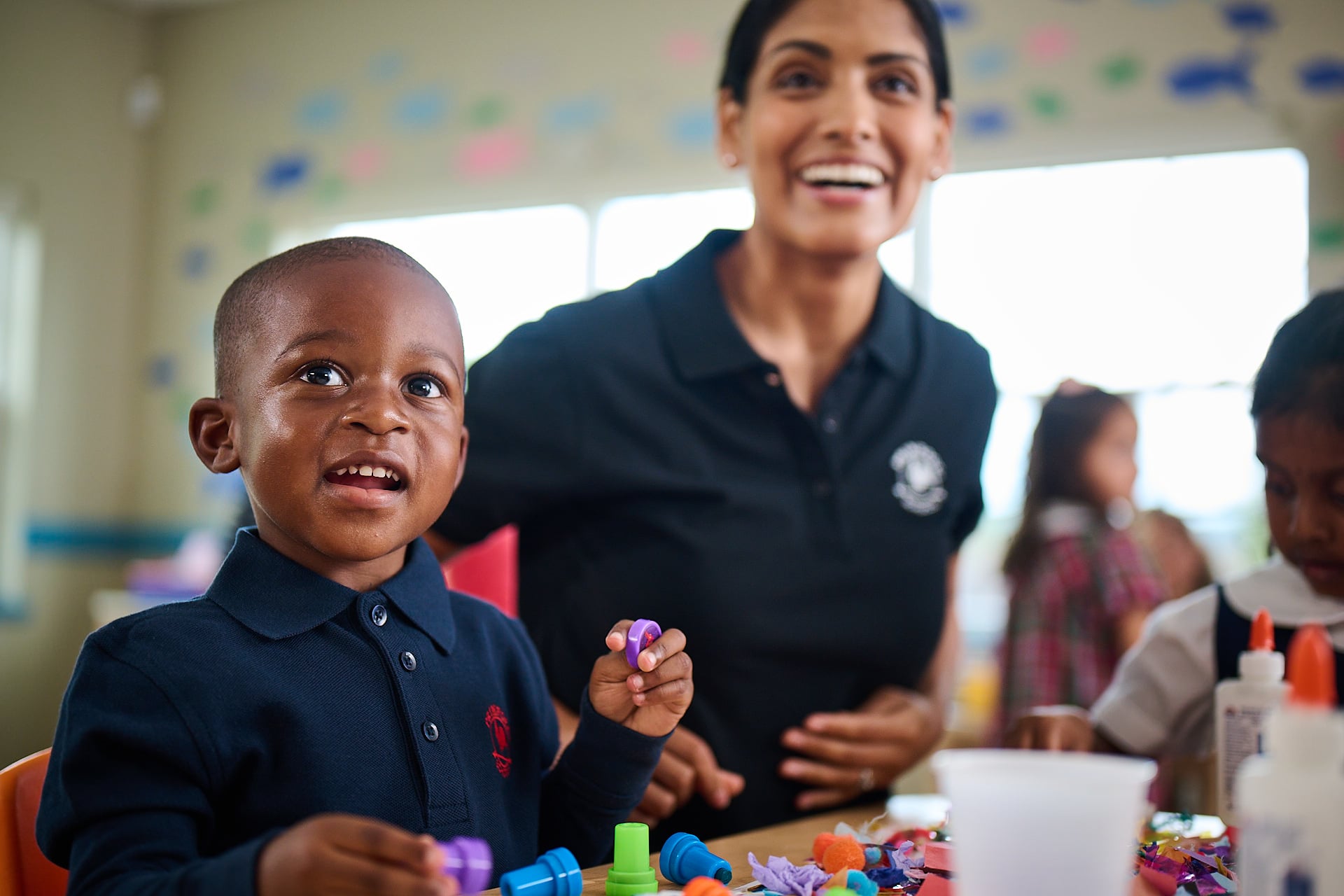 primrose student playing with playdou with teacher