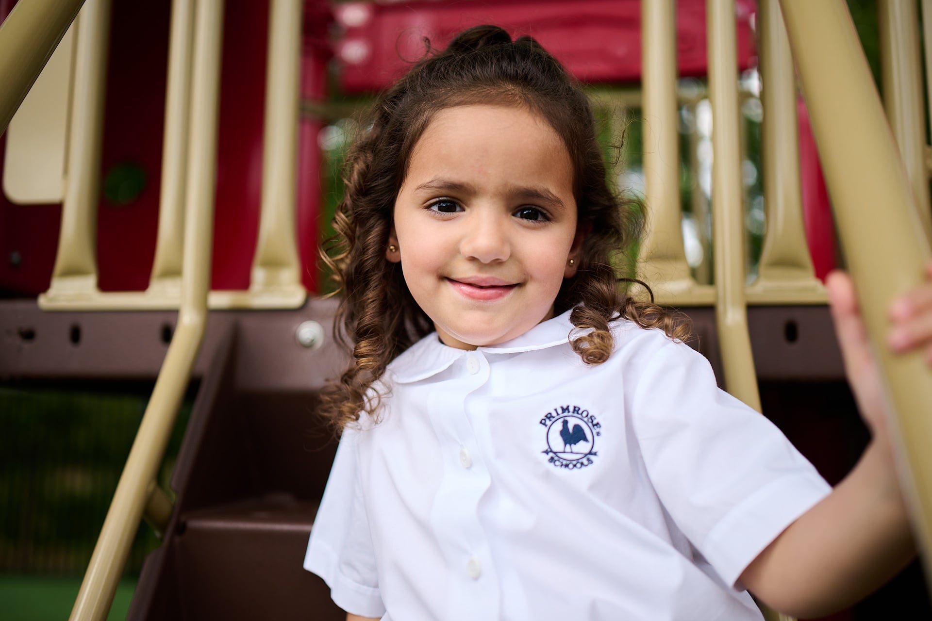 little girl playing on playground
