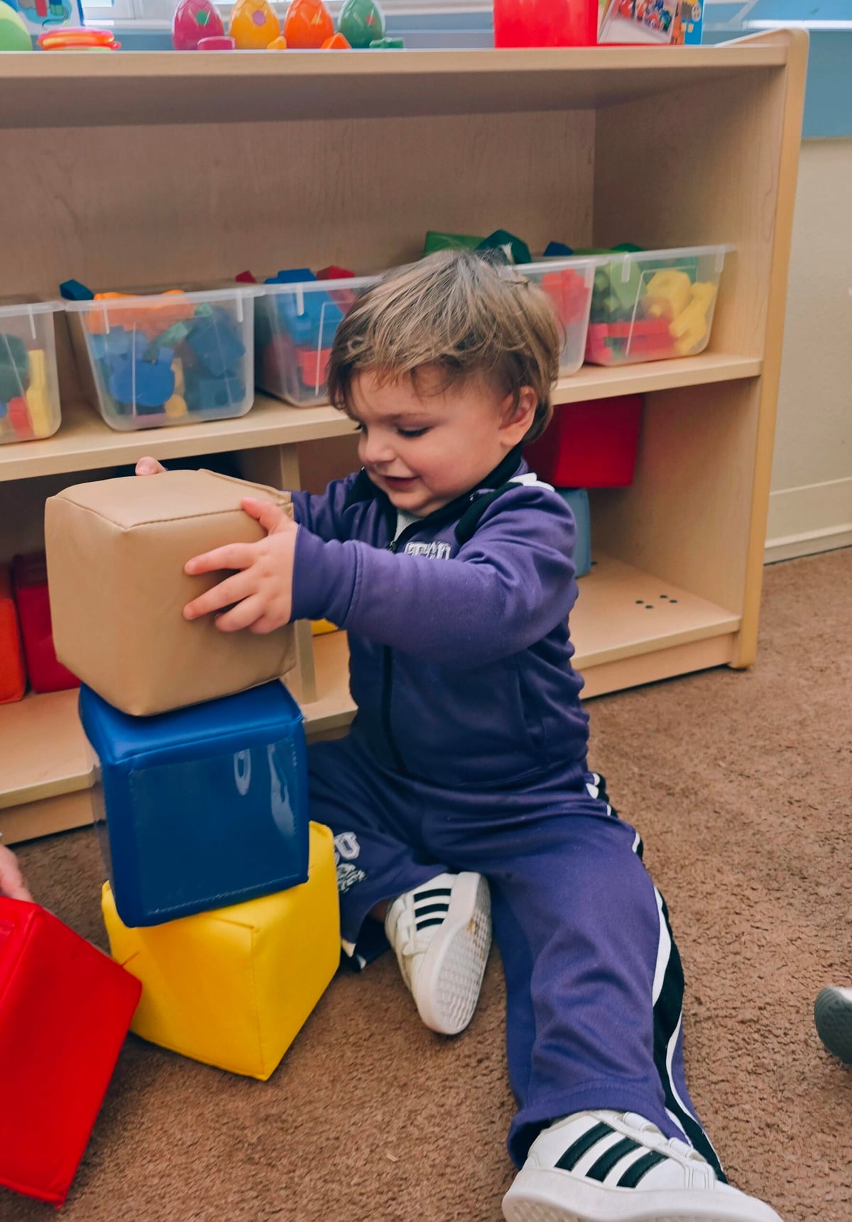 Toddler boy playing in the blocks center at Primrose School at Heritage in Keller, TX
