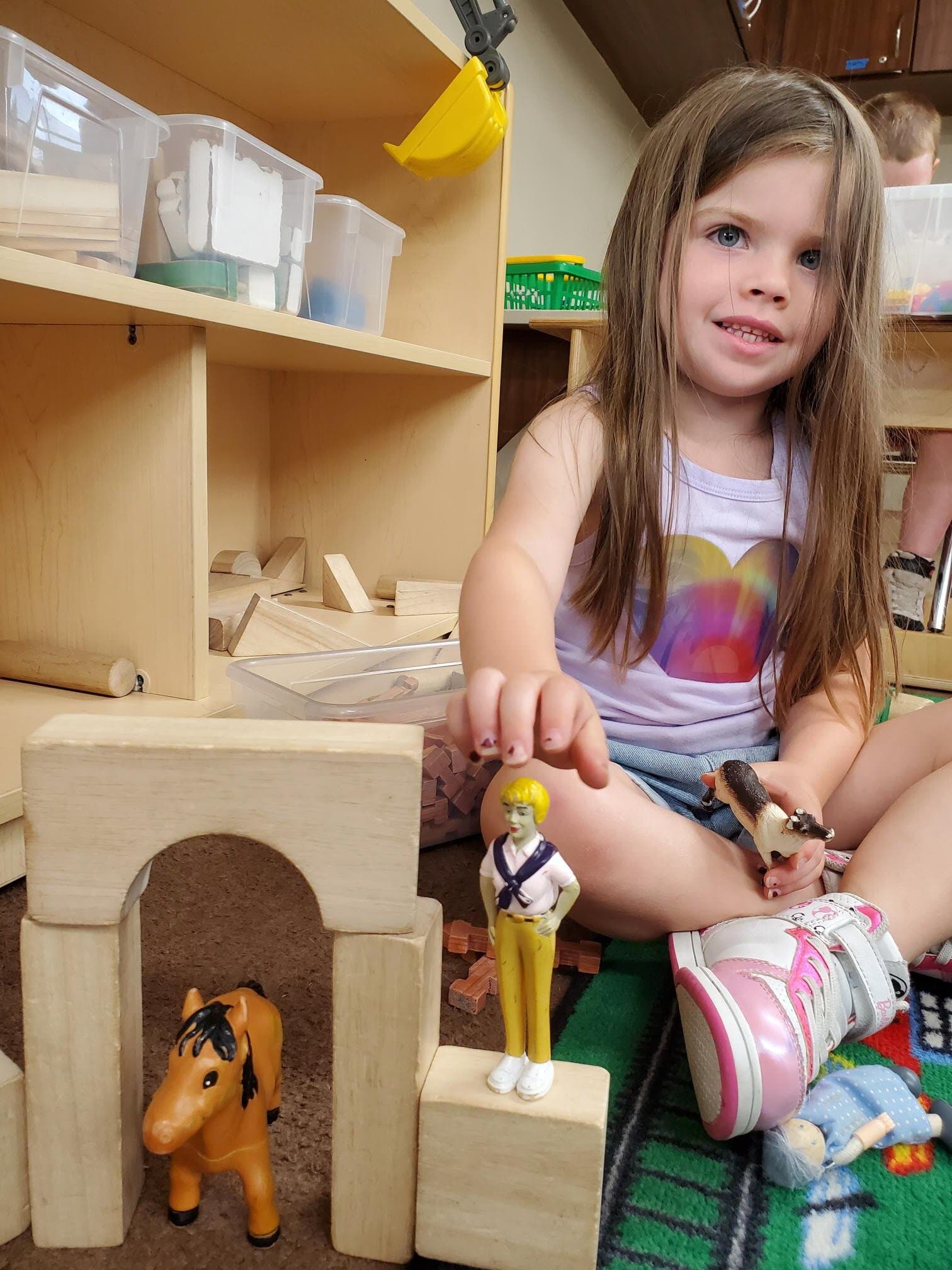 Pre-K student enjoying block center at Fort Worth childcare