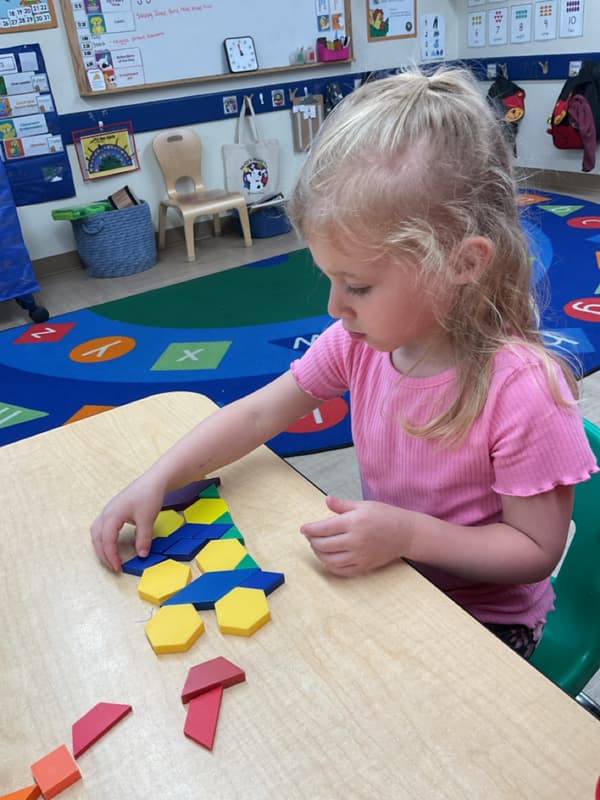 child using math pattern shapes