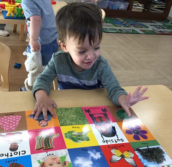 Toddlers learning colors through hands-on play at Fort Worth daycare