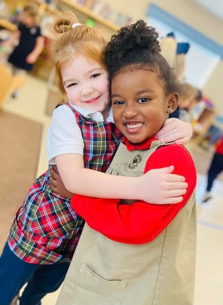pre-k pre-kindergarten kids making friends, showing kindness and care at the best private primrose preschool childcare near me, saginaw, fort worth, texas at Primrose school