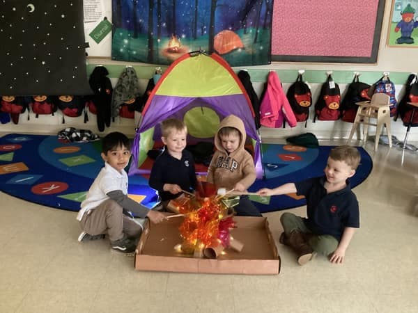 preschoolers making smores in classroom