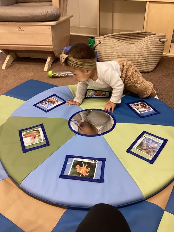 baby crawling on mat