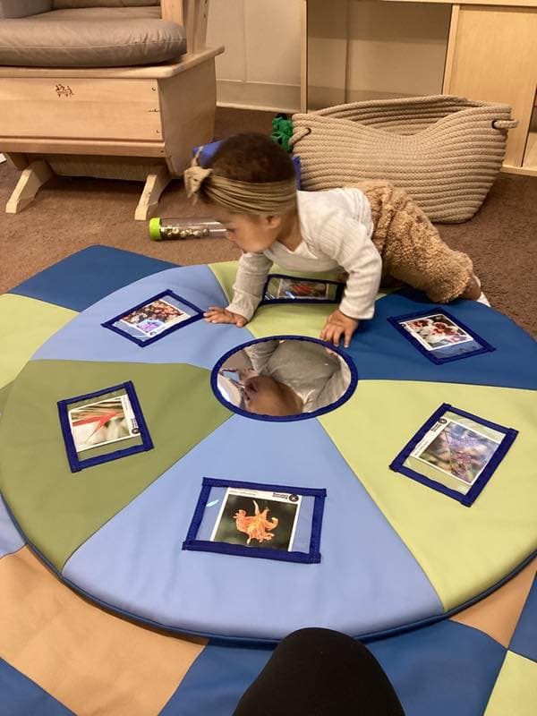 baby crawling on mat
