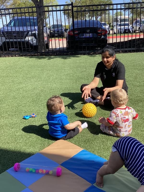 infant play balls on turf