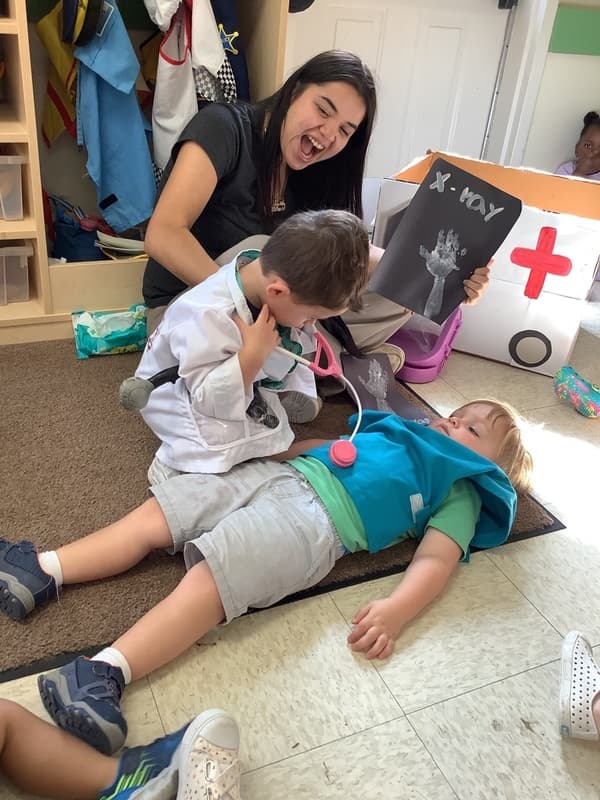 preschoolers playing pretend doctor