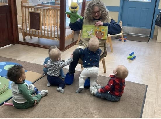 teacher reading to babies