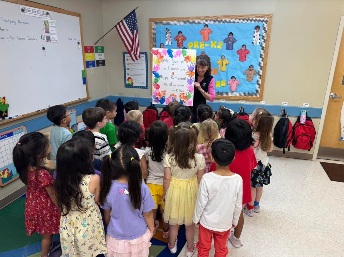 Preschool students gathered together to celebrate and honor their teacher during a heartfelt classroom retirement celebration at Primrose School.