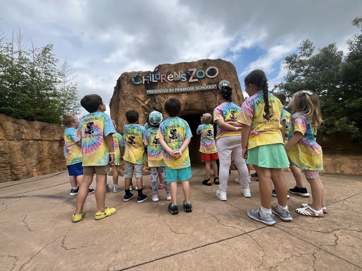 Children standing in front of the Primrose petting zoo